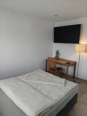 Ein Bett oder Betten in einem Zimmer der Unterkunft Monteurwohnung Ferienwohnung