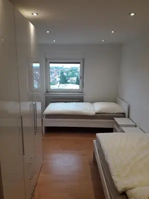 Ein Bett oder Betten in einem Zimmer der Unterkunft Stadtwohnung Eppelheim