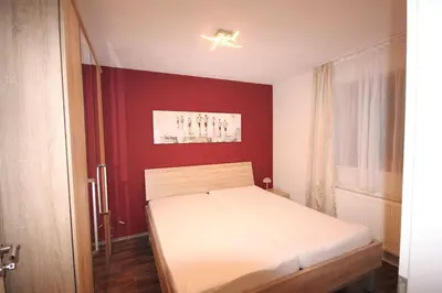 Ein Bett oder Betten in einem Zimmer der Unterkunft Ferienwohnung Siedlungsstraße