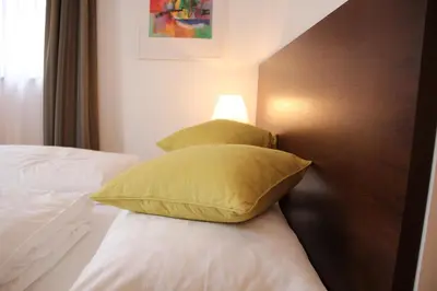 Ein Bett oder Betten in einem Zimmer der Unterkunft Hotel Restaurant Schwan