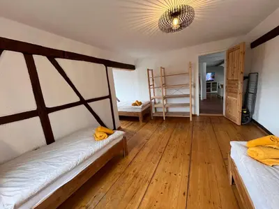 Ein Bett oder Betten in einem Zimmer der Unterkunft Ferienwohnung am Schloss