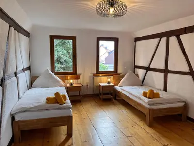 Ein Bett oder Betten in einem Zimmer der Unterkunft Ferienwohnung am Schloss