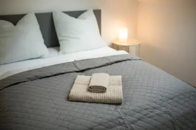 Ein Bett oder Betten in einem Zimmer der Unterkunft HUGOS Design Apartment am Waldrand - ruhig & modern
