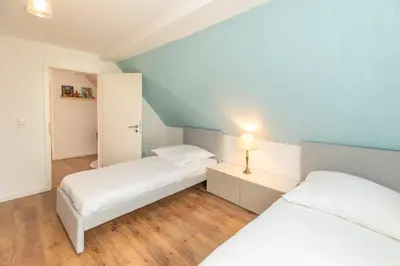 Ein Bett oder Betten in einem Zimmer der Unterkunft Ein Familie Haus in Zentrale Lage