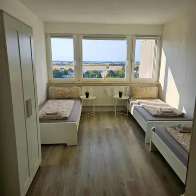 Ein Bett oder Betten in einem Zimmer der Unterkunft City Apartment in Eppelheim near Heidelberg