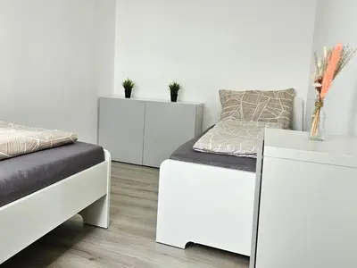 Ein Bett oder Betten in einem Zimmer der Unterkunft City Apartment in Eppelheim near Heidelberg