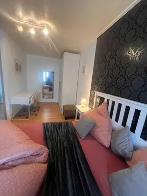 Ein Bett oder Betten in einem Zimmer der Unterkunft Zentrales City Appartement mit Bestlage & gratis Parkplatz