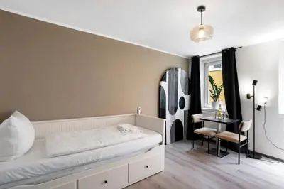 Ein Bett oder Betten in einem Zimmer der Unterkunft Appartio - Gästehaus Altstadt Worms