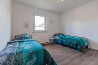 Ein Bett oder Betten in einem Zimmer der Unterkunft nJoy! Apartment Heilbronn - Zentral & Garten