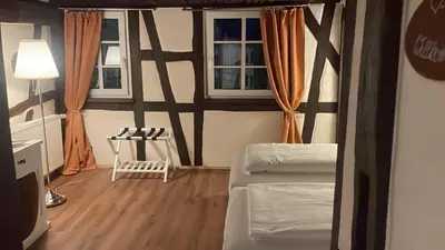 Ein Bett oder Betten in einem Zimmer der Unterkunft Hotel Restaurant Altes Badhaus