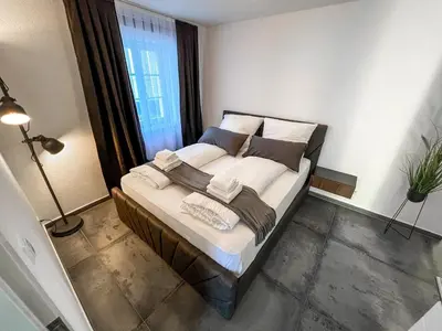 Ein Bett oder Betten in einem Zimmer der Unterkunft Cozy Apartment in Heart of Durlach