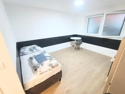 Ein Bett oder Betten in einem Zimmer der Unterkunft 28R, Deluxe Studio-Apartments