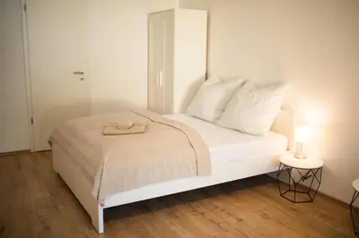 Ein Bett oder Betten in einem Zimmer der Unterkunft HUGOS Design House am Waldrand - ruhig & modern