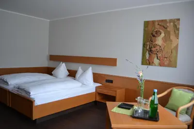 Ein Bett oder Betten in einem Zimmer der Unterkunft Aparthotel Sprendlingen