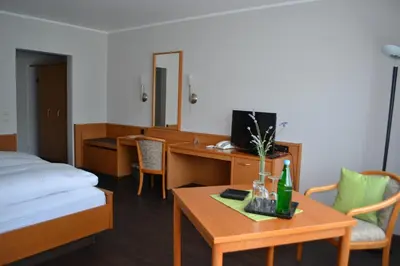 Ein Bett oder Betten in einem Zimmer der Unterkunft Aparthotel Sprendlingen