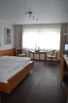 Ein Bett oder Betten in einem Zimmer der Unterkunft Aparthotel Sprendlingen