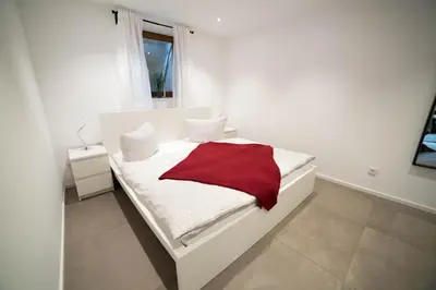 Ein Bett oder Betten in einem Zimmer der Unterkunft Ferienwohnung Hanhofen