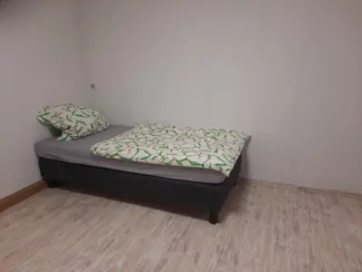 Ein Bett oder Betten in einem Zimmer der Unterkunft gemütliche Wohnung im Herzen von Heilbronn