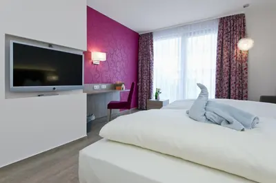 Ein Bett oder Betten in einem Zimmer der Unterkunft Landhotel im Klostereck