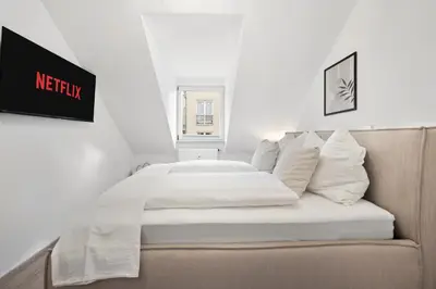 Ein Bett oder Betten in einem Zimmer der Unterkunft Malu Rooms - im Stadtzentrum, Klima, SmartTV, Netflix, 24h Checkin