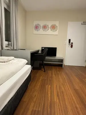 Ein Bett oder Betten in einem Zimmer der Unterkunft Pension Gergert am Neckar