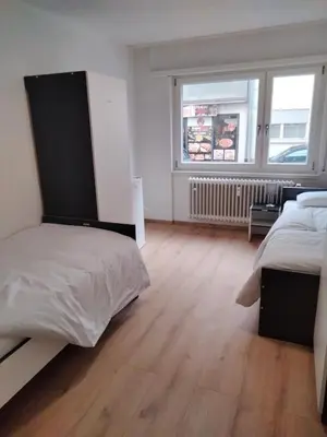 Ein Bett oder Betten in einem Zimmer der Unterkunft MZK Maier Günstig Zentral Einfach 75qm