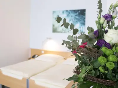 Ein Bett oder Betten in einem Zimmer der Unterkunft Seminarhotel in der Manfred-Sauer-Stiftung