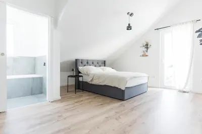 Ein Bett oder Betten in einem Zimmer der Unterkunft Moderne Unterkünfte in Walldorf