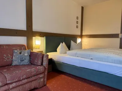Ein Bett oder Betten in einem Zimmer der Unterkunft Landgasthof Waldschlösschen