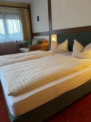 Ein Bett oder Betten in einem Zimmer der Unterkunft Landgasthof Waldschlösschen