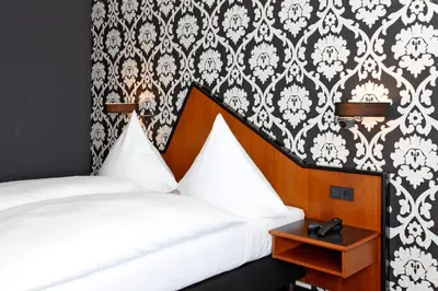 Ein Bett oder Betten in einem Zimmer der Unterkunft Hotel Apartment Laforsch