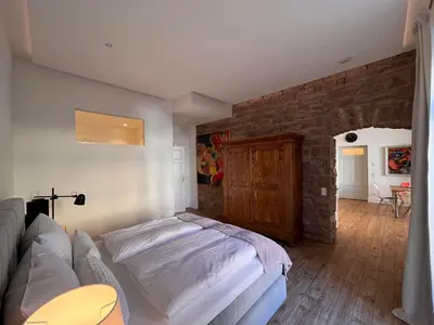 Ein Bett oder Betten in einem Zimmer der Unterkunft Zweite Heimat Heidelberg