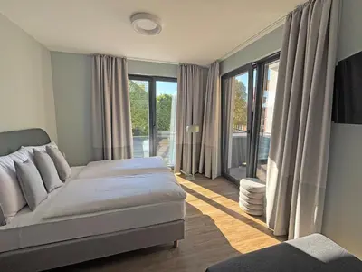 Ein Bett oder Betten in einem Zimmer der Unterkunft Motel Living Walldürn