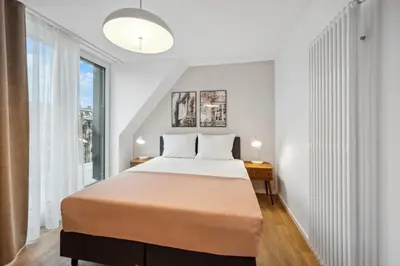 Ein Bett oder Betten in einem Zimmer der Unterkunft Limehome Karlsruhe Sophienstr