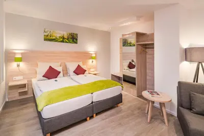 Ein Bett oder Betten in einem Zimmer der Unterkunft Landhotel Zur Bretzel