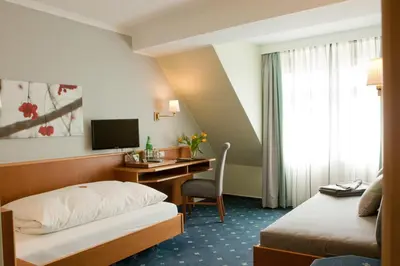 Ein Bett oder Betten in einem Zimmer der Unterkunft Landhotel Zur Bretzel