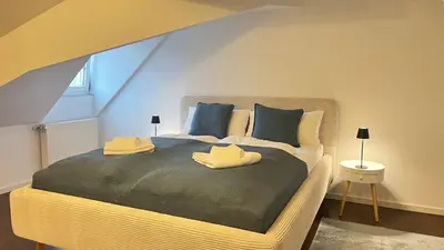 Ein Bett oder Betten in einem Zimmer der Unterkunft LudwigsHome Zentral, Spacious, 120qm, Klima