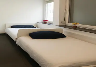 Ein Bett oder Betten in einem Zimmer der Unterkunft Eva Zimmer Zentral Günstig