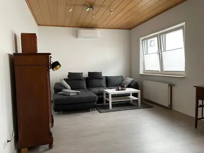 Ein Sitzbereich in der Unterkunft Klimatisierte Wohnung