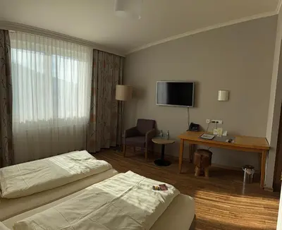 Ein Bett oder Betten in einem Zimmer der Unterkunft Landhotel Kuralpe Kreuzhof