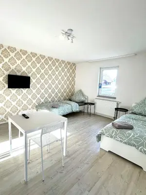 Ein Bett oder Betten in einem Zimmer der Unterkunft Ganze Wohnung - Küche - Balkon - Parkplatz - WLAN - bis zu 6 Personen