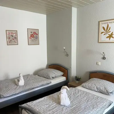 Ein Bett oder Betten in einem Zimmer der Unterkunft Family and Friends Dannstadt