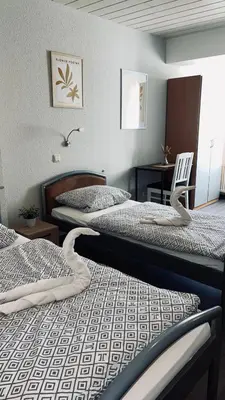 Ein Bett oder Betten in einem Zimmer der Unterkunft Family and Friends Dannstadt