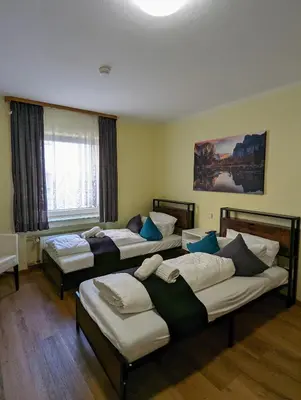 Ein Bett oder Betten in einem Zimmer der Unterkunft City Rooms Rastatt