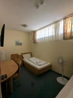 Ein Bett oder Betten in einem Zimmer der Unterkunft City Rooms Rastatt