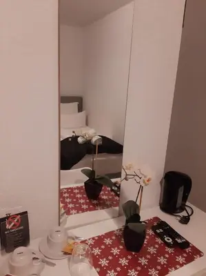 Ein Badezimmer in der Unterkunft City Rooms Rastatt