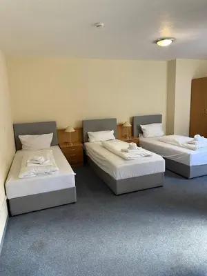 Ein Bett oder Betten in einem Zimmer der Unterkunft City Rooms Rastatt