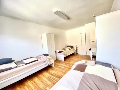 Ein Bett oder Betten in einem Zimmer der Unterkunft City Rooms Tamm