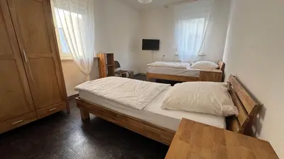 Ein Bett oder Betten in einem Zimmer der Unterkunft Hammer & Rest WHG2