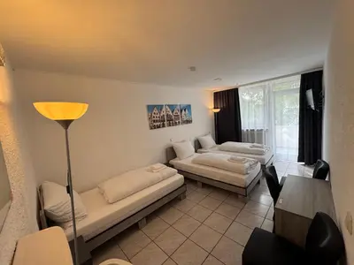 Ein Bett oder Betten in einem Zimmer der Unterkunft Hotel Main Taunus